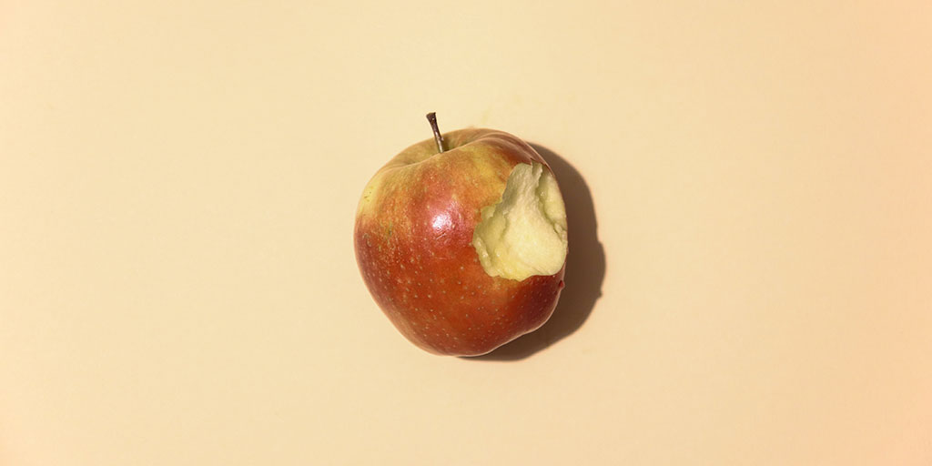 An image of an apple (the fruit) with a bite taken out of it